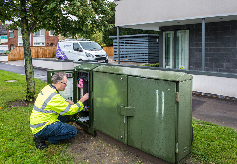 Image of engineer working on a cabinet