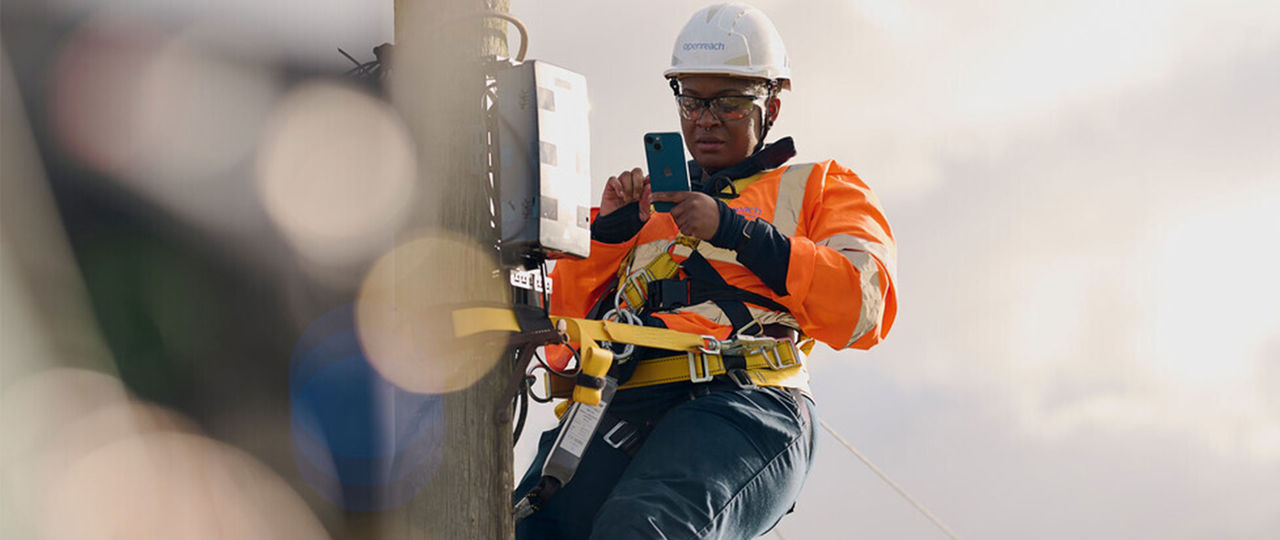 Openreach engineer with equipment outside a property
